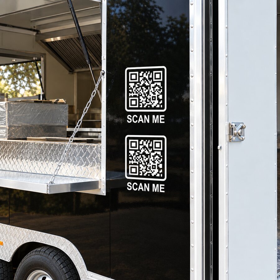 Two smaller SCAN ME decals on a food trailer door
